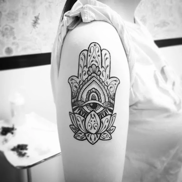 black and white hamsa hand withall seeing eye and lotus flower shoulder tattoo tattoos with meaning of life