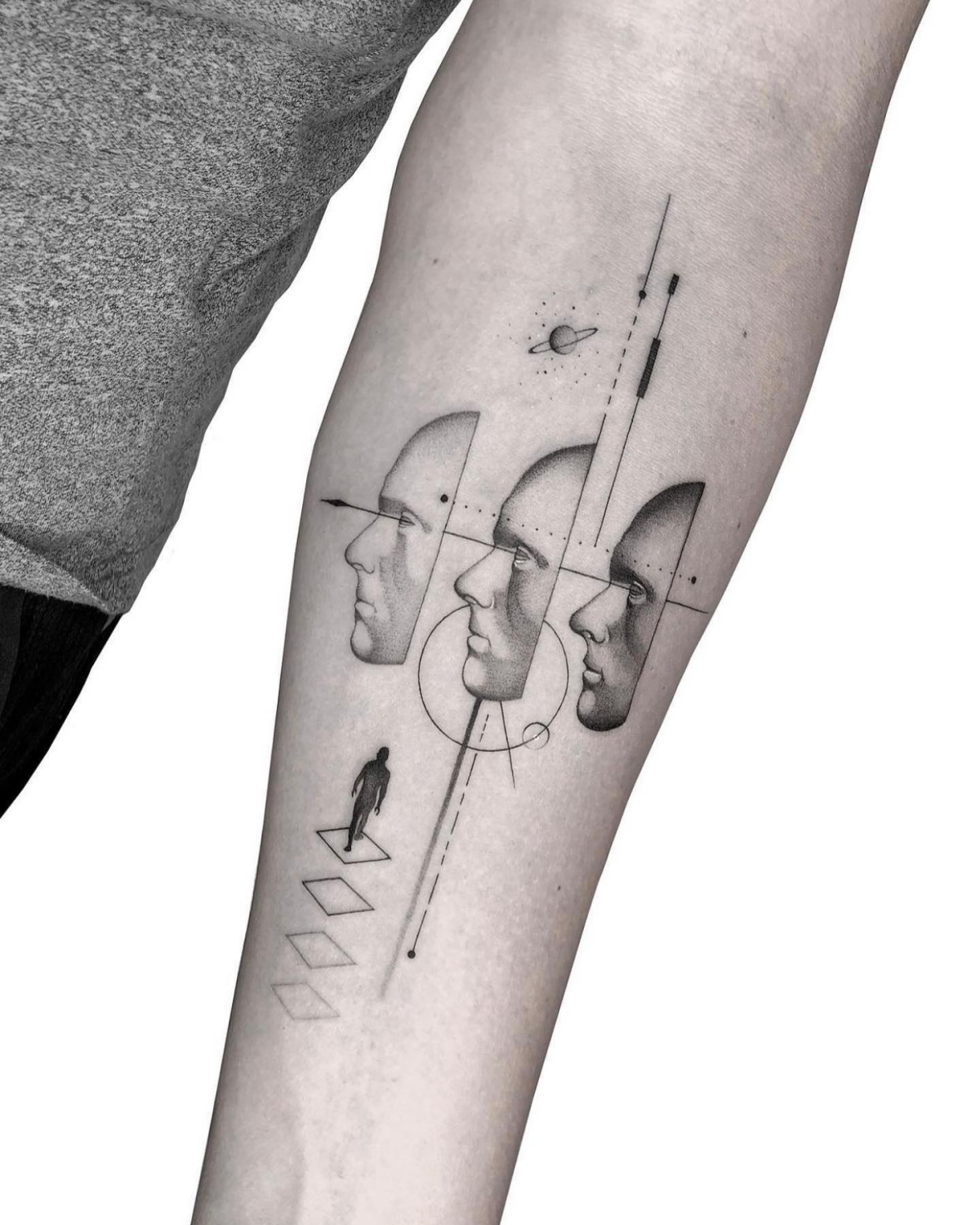 fine line tattoo of faces